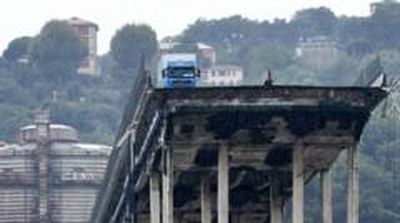 A large section of the giant Morandi motorway bridge crumbled and collapsed on to the railway tracks