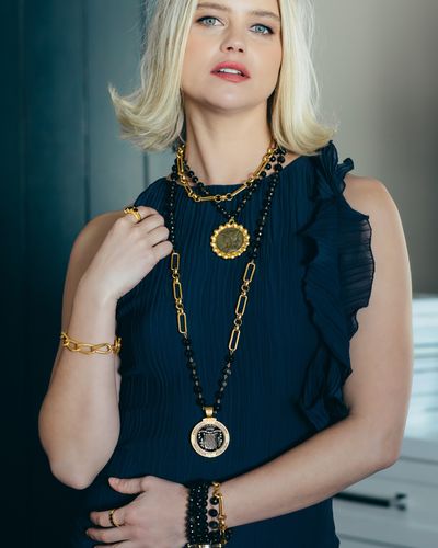 Dark. Bold. Unapologetic. Sunset Obsidian meets gold chains for a look that commands attention. Pair